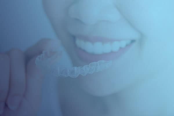 Smiling lady with Invisalign